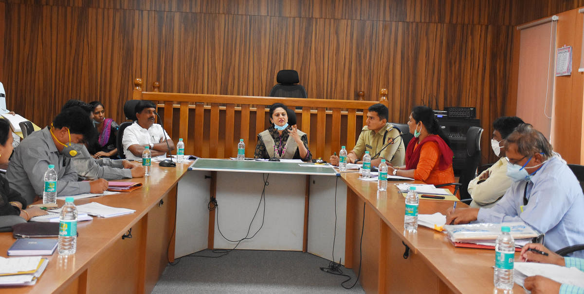 Deputy Commissioner R Latha speaking to the officials during the meeting in Chikkaballapur.
