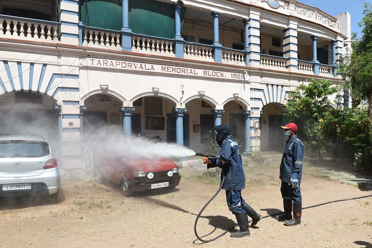 Firefighters from Ahmedabad Fire and Emergency Services spray disinfectant in a residential colony during a government-imposed nationwide lockdown as a preventive measure against the COVID-19 coronavirus, in Ahmedabad on April 3, 2020. Credit: AFP Photo