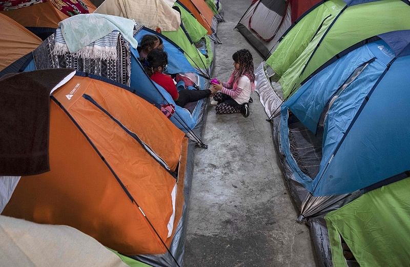Members of an asylum-seeker family remain in a tent at the Juventud 2000 migrant shelter in Tijuana, Baja California. (AP Photo)