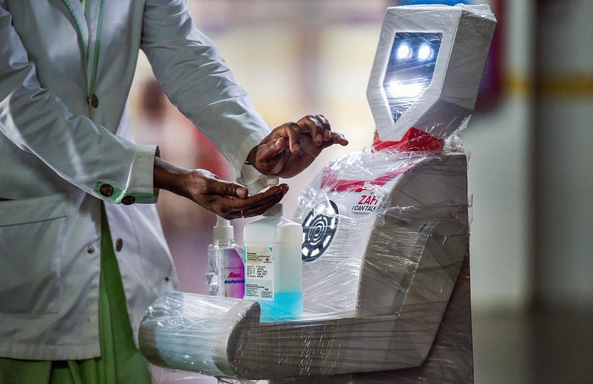 Medical staff participates in a demo of the interactive robot 'Zafi' which will be deployed at COVID-19 isolation wards, at Stanley Medical hospital in Chennai, Monday, April 6, 2020. Credit: PTI Photo