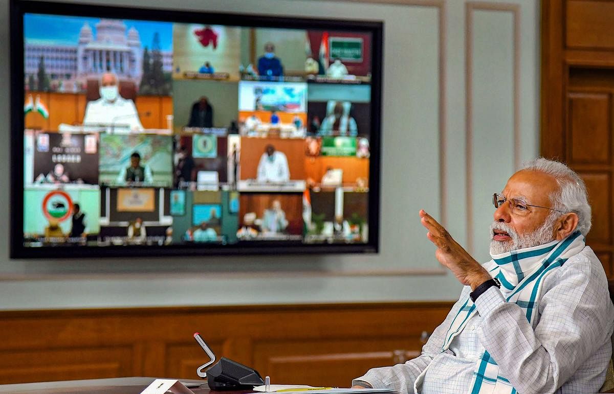 Prime Minister Narendra Modi (foreground) interacts with the Chief Ministers of various States/UTs via video conferencing to discuss the situation arising due to the novel coronavirus pandemic, in New Delhi, Monday, April 27, 2020. (PTI Photo)