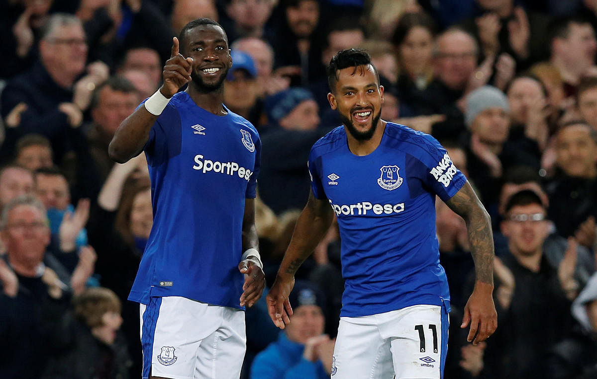 Everton's Theo Walcott (right) celebrates with Yannick Bolasie after scoring against Newcastle United on Monday. REUTERS