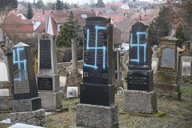 Swastikas painted on graves at a Jewish cemetery in the French town of Quatzenheim close to the German border (Photo/AFP)