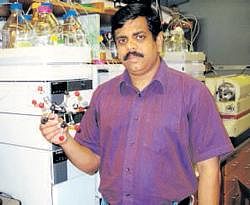 Ajikumar with a model of taxol molecule.