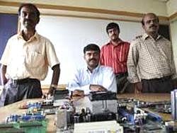 Greater opportunities: Chezi Ganesan, president of VinChip Systems, with his engineering managers in Chennai. NYT