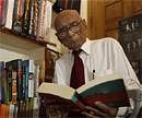 Indian freedom fighter Bholaram Das poses for photographs at his library in Gauhati on Sunday. AP