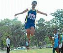 Grit: Mahesh Kumar A S jumps 6.55M to clinch gold medal in long jump at the Mysore City Inter-Collegiate Athletic Meet 2010-11, at Oval Grounds in Mysore on Tuesday. DH Photos