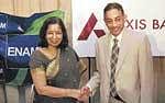 Axis Bank Managing Director & CEO Shikha Sharma with Enam Securities Chairman Vallabh Bhansali, briefing reporters, in Mumbai, on Wednesday. PTI