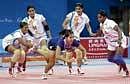 SOLID SHOW:  Mamtha Poojari (No 10) and skipper Tejaswini Bai (extreme right) in action during the kabaddi competitions at the Asian Games.