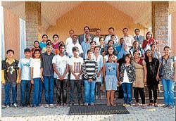 Foreign delegates from 11 countries seen with the students of Jnanasarovara International Residential School (JIRS), in Mysore. DH photo