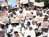 Congress legislators from Telangana region hold placards during their indefinite hunger strike demanding separate Telangana state in Hyderabad. PTI Photo