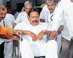 Mayor S K Nataraj arrives in a wheel chair for the Palike meeting in Bangalore on Wednesday. DH Photo