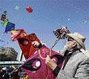 Chief Minister Narendra Modi manages his string of kites  at the international kite festival in Ahmedabad on Tuesday. Photo by K Bharwad