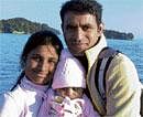 In happier times: Scientist Dinesh, wife Navya Rani and their baby, who returned to Bangalore on Wednesday.