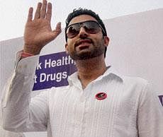 Bollywood Actor Abhishek Bachchan waves to participants of ''Run Against Drug Abuse'' organised on Narcotics Control Bureau's (NCB) Silver Jubilee, in Mumbai on Sunday. PTI