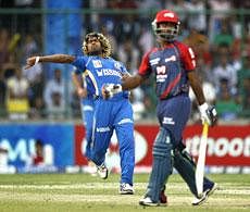 Mumbai Indians' Lasith Malinga, left, celebrates after claiming the wicket of Delhi Daredevils' Venugopal Rao during their Indian Premier League cricket match in New Delhi, India on Sunday. AP Photo