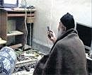 A man the American government says is Osama bin Laden watches television in this undated image taken from a video provided by the US Department of Defence and released on Saturday. AP