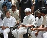 ICC General Secretary Rahul Gandhi along with party leader Digvijay Singh interacts with the villagers of Bhatta Parsaul in Greater Noida on Wednesday . PTI File Photo