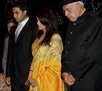 Bollywood actor Abhishek Bachchan, his wife Aishwarya Rai Bachchan and Union New and Renewable Energy Minister Farooq Abdullah, maintains a one minute silence for the Mumbai blast victims, during ''Art De Vivre A La Francaise'', a prestigious French Lifestyle show in New Delhi on Wednesday. PTI Photo