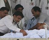 A team of doctors examining the health of Anna Hazare during 7th day of his fast against corruption at Ramlila ground in New Delhi on Monday. PTI Photo