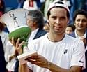 Spain's Albert Montanes with the trophy after winning the Estoril Tennis Open in Oeiras, Portugal, on Sunday.