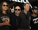 US heavy metal and rock band Metallica members from left to right Kirk Hammett, Lars Ulrich, James Hetfield and Robert Trujillo pose for media during a press conference, in Gurgoan on the outskirts of New Delhi, India, Friday, Oct. 28, 2011. According to Indian news agency Press Trust of India, rock band Metallica's maiden concert in India failed to kick off Friday triggering chaos at the venue and leaving thousands of fans disappointed. After citing technical problems for the postponement, the concert organizers said concert will be held tomorrow. AP Photo