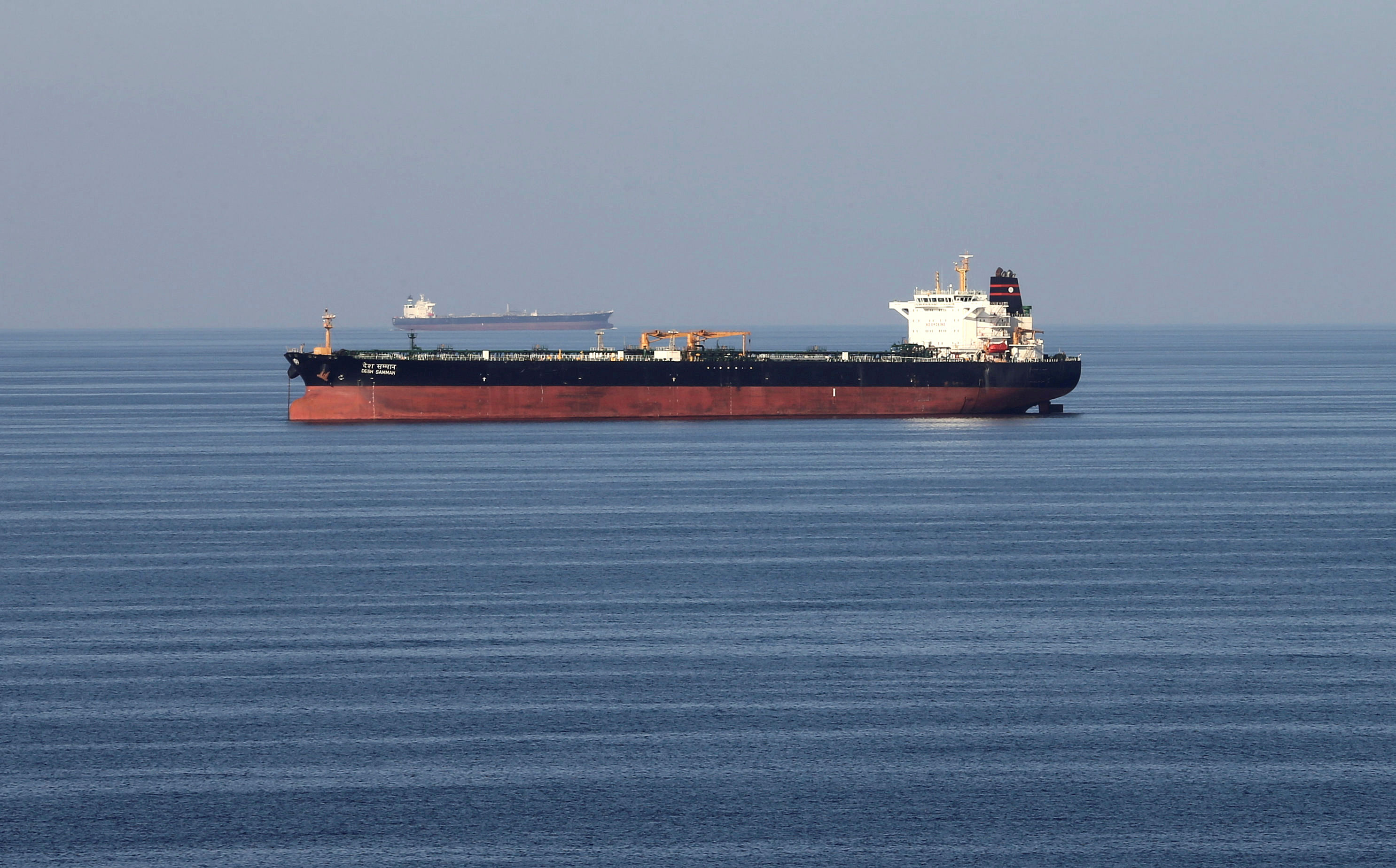 Oil tankers pass through the Strait of Hormuz. (Credit: Reuters)