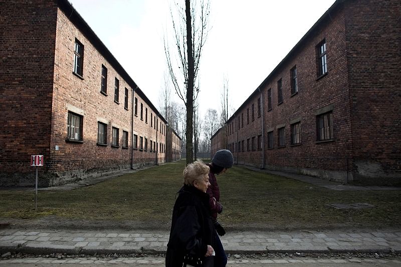 Jona Laks, survivor of Nazi Dr. Josef Mengele's experiments and her granddaughter, Lee Aldar walk as they visit the Auschwitz death camp, in Oswiecim, Poland. (Reuters Photo)