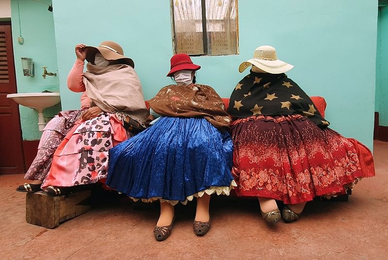 Bolivian sex workers sit during a Reuters interview before the countrywide, two-week mandatory quarantine to combat the spread of coronavirus disease (COVID-19), decreed by Bolivia's interim government, in El Alto outskirts of La Paz, Bolivia. (Reuters Photo)