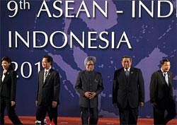 Leaders, from left, Thailand Prime Minister Yingluck Shinawatra, Vietnam Prime Minister Nguyen Tan Dung, India's Prime Minister Manmohan Singh, Indonesian President Susilo Bambang Yudhoyono, and Cambodian Prime Minister Hun Sen walk out after a photo session during the Association of Southeast Asian Nations (ASEAN) and India Summit in Nusa Dua, Bali, Indonesia, Nov. 19, 2011. AP