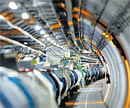 CREATING THE BIG BANG Part of the Large Hadron Collider is seen in its  tunnel at CERN near Geneva. File photo