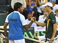 Rohan Bopanna of India (L) shakes hands with Rik De Voest of South Africa, after winning the  Davis Cup singles on Friday. AP