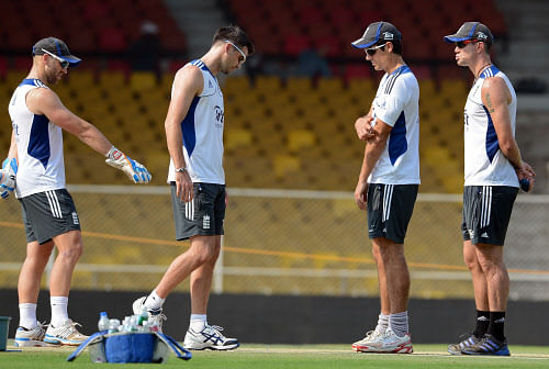 England cricketers (L-R) Matt Prior, James Anderson, captain Alastair Cook, and Kevin Pietersen inspect the pitch at The Sardar Patel Stadium at Motera in Ahmedabad on November 14, 2012. England plays their first test cricket match against India from November 15 in Ahmedabad. AFP