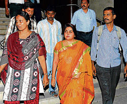 in the dock: Corporator Kumari Avvayi (centre) being taken away after she was caught  red-handed while accepting a bribe in the City on Tuesday. dh photo