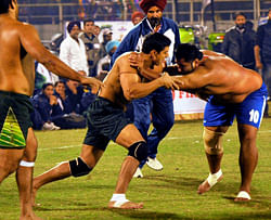India and Pakistan Kabaddi Team players in Action during Kabaddi world Cup 2012 final match in Ludhiana on Saturday. India beat Pakistan 59-22 point . PTI Photo