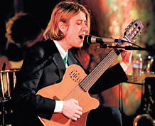 Strumming Christopher Owens, at a performance. photos by Jim Wilson/NYT