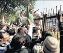 UP IN&#8200;ARMS: INLD supporters shout slogans during a protest at Rohini district court in New Delhi on Tuesday. PTI