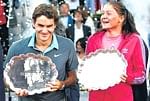 Roger Federer and Dinara Safina with their trophies in Madrid on Sunday. Reuters
