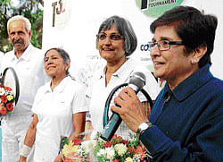 Down memory lane: (From right) Former national tennis players Kiran Bedi, Udaya Kumar, Dechu Moola and CGK Bhupathi interact with the fans during an exhibition match at the Indiranagar Club in Bangalore on Saturday. dh photo