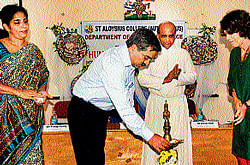 IGP (Western Range) Prathap Reddy lights lamp to inaugurate a one-day workshop on                 Human Rights Advocacy at St Aloysius College in Mangalore on Wednesday. DH photo