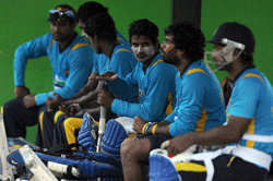 Sri Lankan cricketer Kushal Janith Perera (C) gestures during a practice session at The Pallekele International Cricket Stadium in Pallekele on March 27, 2013, ahead of their third and final one day international (ODI) match against Bangladesh on March 28. AFP PHOTO