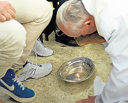 Pope Francis kisses the foot of an inmate at the juvenile detention centre of Casal del Marmo, Rome, on Thursday. AP photo