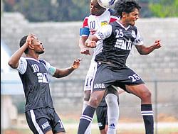 Mohammedan Sportings J Prasad (right) and Alfred K Jaryan (left) vie for possession with Southern Samitys Marcos ADC Pereira. DH PHOTO/ SATISH BADIGER