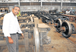 U Subba Rao Chief Workshop Manager, Central Workshop, South Western Railway at the railway workshop shows where the composite brake blocks are fitted. dh photos