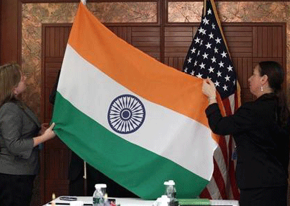Technical Sergeants from the U.S. Department of Defense display the flags of India and the United States before a bilateral meeting during the Shangri-La Dialogue Asia Security Summit in Singapore June 4, 2010. Credit: Reuters
