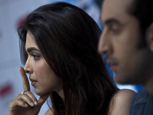File photo:Deepika Padukone gestures next to actor Ranbir Kapoor during a press conference held to promote their new Hindi film "Yeh Jawani Hai Deewani" in New Delhi, India, Monday, May 27, 2013. The film will be released on May 31. AP Photo