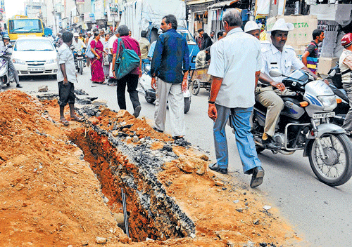 no relief in sight: Shopkeepers allege unscientific drainage work has led to utter chaos on Avenue Road. DH Photo