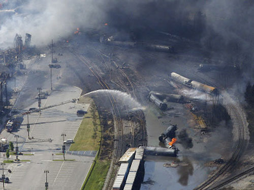 The wreckage of a train is pictured after an explosion in Lac Megantic July 6, 2013. Several people were missing after four tank cars of petroleum products exploded in the middle of a small town in the Canadian province of Quebec early on Saturday in a fiery blast that destroyed dozens of buildings. REUTERS
