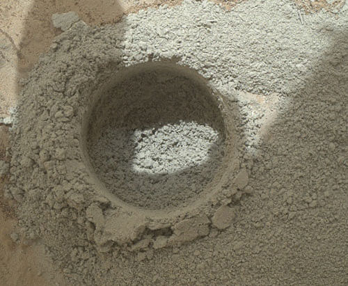 A close-up view of the results of the 'mini drill test' by NASA's Mars rover Curiosity, is seen recorded by rover's Mars Hand Lens Imager (MAHLI) camera during the 180th Martian day, or sol, of the rover's work on Mars in this February 6, 2013 handout image courtesy of NASA.  Reuters