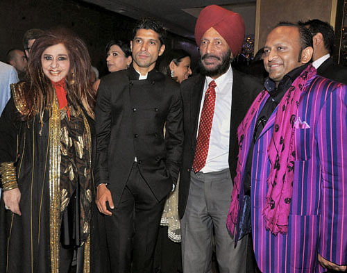Beautician Shahnaz Husain, actor Farhan Akhtar and legendary athlete Milkha Singh at the premiere of the film 'Bhag Milkha Bhag', a film based on the athlete's life, in London on Monday. PTI Photo